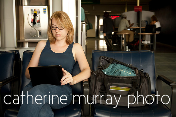 Woman in Airport Using Netbook