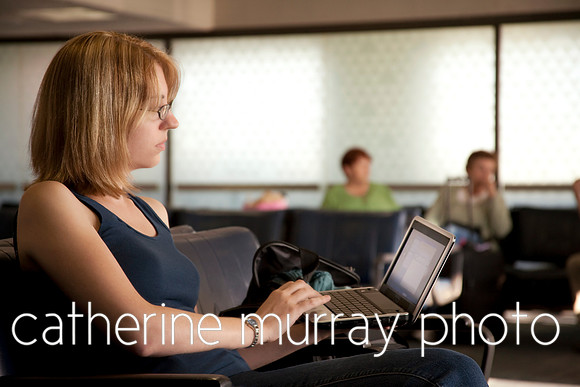 Woman in Airport Using Netbook