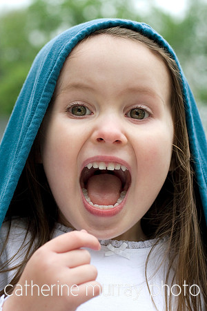 Hooded Girl Singing with Imaginary Microphone