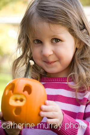 Little Girl With Pumpkin